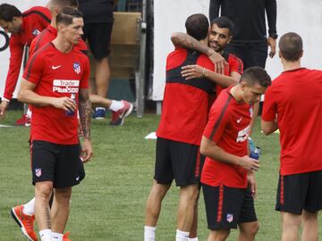 Augusto greets his team mates on Atlético's first day back.