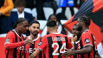 Nice's Nigerian forward #09 Terem Moffi (R) celebrates with teammates after scoring his team's first goal during the French L1 football match between OGC Nice and Toulouse FC at the Allianz Riviera Stadium in Nice, south-eastern France, on November 26, 2023. (Photo by Valery HACHE / AFP)