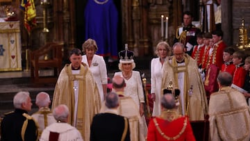 Viewers of the ceremony at Westminster Abbey may have noticed two women dressed in white assisting Queen Camilla while the Coronation was taking place