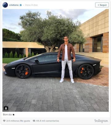 Real Madrid's number 7 poses in front of a black Lamborghini.