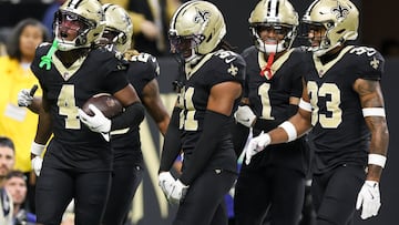 Oct 5, 2025; New Orleans, Louisiana, USA; New Orleans Saints cornerback Kool-Aid McKinstry (4) and New Orleans Saints safety Jordan Howden (31) celebrate after an interception against the New York Giants during the fourth quarter at Caesars Superdome. Mandatory Credit: Stephen Lew-Imagn Images