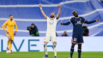 MADRID, SPAIN - MARCH 09: Karim Benzema of Real Madrid (C) celebrates after scoring their team's second goal as Danilo Pereira of Paris Saint-Germain (R) looks dejected during the UEFA Champions League Round Of Sixteen Leg Two match between Real Madrid an