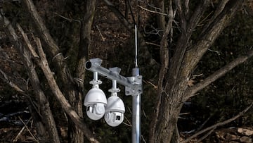 CCTV cameras are seen next to a slope at the Yanqing National Alpine Skiing Centre in Yanqing, during the Beijing 2022 Winter Olympic Games, on February 5, 2022. (Photo by Fabrice COFFRINI / AFP)