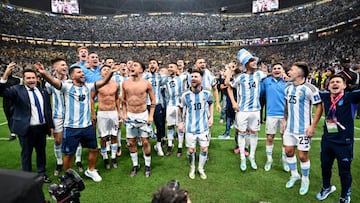 LUSAIL CITY, QATAR - DECEMBER 18: Players of Argentina celebrates in front of their fans after defeating France in the penalty shootout to win the World Cup Final during the FIFA World Cup Qatar 2022 Final match between Argentina and France at Lusail Stadium on December 18, 2022 in Lusail City, Qatar. (Photo by Tullio Puglia - FIFA/FIFA via Getty Images)