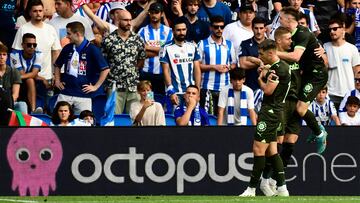 Girona's Ukrainian forward #09 Artem Dovbyk (2R) celebrataes scoring the second goal of the Spanish Liga football match between Real Sociedad and Girona FC at the Reale Arena stadium in San Sebastian on August 12, 2023. (Photo by ANDER GILLENEA / AFP)