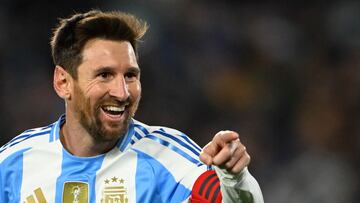 TOPSHOT - Argentina's forward #10 Lionel Messi celebrates after scoring his second goal during the 2026 FIFA World Cup South American qualifiers football match between Argentina and Venezuela at the Mas Monumental stadium in Buenos Aires on September 4, 2025. (Photo by Luis ROBAYO / AFP)