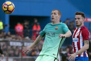 Barcelona's French defender Jeremy Mathieu vies with Atletico Madrid's midfielder Saul Niguez during the LaLiga game last weekend.