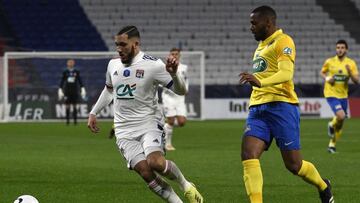 Lyon's French forward Rayan Cherki (L) fights for the ball with Sochaux's French defender Johan Martial (R) during the French Cup round-of-32 football match between Lyon (OL) and Sochaux (FCSM) at The Groupama Stadium in Decines-Charpieu, near L