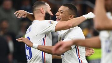 France&#039;s forward Karim Benzema (L) and France&#039;s forward Kylian Mbappe (R) celebrate their victory at the end of the Nations League final football match between Spain and France at San Siro stadium in Milan, on October 10, 2021. (Photo by FRANCK 