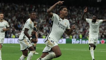 Real Madrid's English midfielder #5 Jude Bellingham celebrates with teammates scoring his team's first goal during the UEFA Champions League 1st round day 1 group C football match between Real Madrid and Union Berlin at the Santiago Bernabeu stadium in Madrid on September 20, 2023. (Photo by Thomas COEX / AFP)