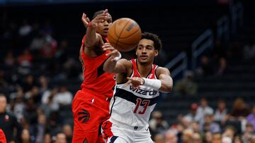 Oct 11, 2024; Washington, District of Columbia, USA; Washington Wizards guard Jordan Poole (13) passes the ball as Toronto Raptors guard Jahmi'us Ramsey (37) defends in the second quarter at Capital One Arena. Mandatory Credit: Geoff Burke-Imagn Images