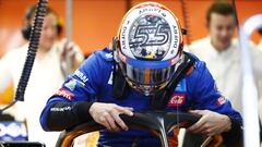 Carlos Sainz, McLaren, enters the cockpit