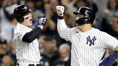 NEW YORK, NEW YORK - OCTOBER 11: Anthony Rizzo #48 of the New York Yankees celebrates with Aaron Judge #99 after hitting a two run home run against Cal Quantrill #47 of the Cleveland Guardians during the sixth inning in game one of the American League Division Series at Yankee Stadium on October 11, 2022 in New York, New York.   Sarah Stier/Getty Images/AFP