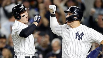 NEW YORK, NEW YORK - OCTOBER 11: Anthony Rizzo #48 of the New York Yankees celebrates with Aaron Judge #99 after hitting a two run home run against Cal Quantrill #47 of the Cleveland Guardians during the sixth inning in game one of the American League Division Series at Yankee Stadium on October 11, 2022 in New York, New York.   Sarah Stier/Getty Images/AFP