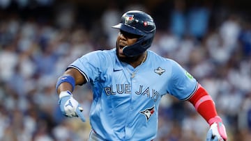 LOS ANGELES, CALIFORNIA - OCTOBER 28: Vladimir Guerrero Jr. #27 of the Toronto Blue Jays celebrates after hitting a two-run home run in the third inning against the Los Angeles Dodgers in game four of the 2025 World Series at Dodger Stadium on October 28, 2025 in Los Angeles, California. Ronald Martinez/Getty Images/AFP (Photo by RONALD MARTINEZ / GETTY IMAGES NORTH AMERICA / Getty Images via AFP)