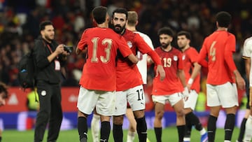 Egypt's defender #13 Ahmed Fatouh (L) embraces Egypt's midfielder #17 Mohanad Lasheen at the end of the international friendly football match between Spain and Egypt at�RCDE Stadium in Cornella de Llobregat, near Barcelona, on March 31, 2026. The match ended in a scoreless draw 0-0. (Photo by Lluis GENE / AFP)