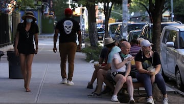 People drink outside a bar during the reopening phase following the coronavirus disease (COVID-19) outbreak in the East Village neighborhood of New York City, New York, U.S., June 13, 2020. REUTERS/Caitlin Ochs