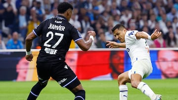 Soccer Football - Ligue 1 - Olympique de Marseille v Auxerre - Orange Velodrome, Marseille, France - April 30, 2023 Auxerre's Julian Jeanvier in action with Olympique de Marseille's Alexis Sanchez REUTERS/Eric Gaillard