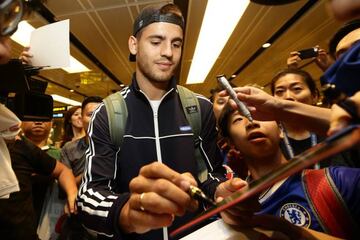 Morata attends fans on arrival in Singapore.