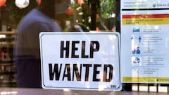 A &#039;Help Wanted&#039; sign is poster at a restaurant in Los Angeles, California. - Fewer Americans filed unemployment benefit claims last week, government data said.