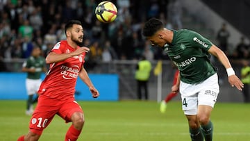 Montpellier&#039;s French forward Andy Delfort (L) vies with Saint-Etienne&#039;s French forward William Saliba (R) during the French L1 football match between Saint-Etienne (ASSE) and Montpellier (MHSC) on May 10, 2019, at the Geoffroy Guichard Stadium i