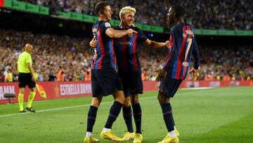BARCELONA, SPAIN - AUGUST 28: Robert Lewandowski of Barcelona celebrates with teammates Lazar Carevic and Ousmane Dembele after scoring their side's third goal during the LaLiga Santander match between FC Barcelona and Real Valladolid CF at Camp Nou on August 28, 2022 in Barcelona, Spain. (Photo by David Ramos/Getty Images)