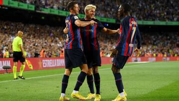 BARCELONA, SPAIN - AUGUST 28: Robert Lewandowski of Barcelona celebrates with teammates Lazar Carevic and Ousmane Dembele after scoring their side's third goal  during the LaLiga Santander match between FC Barcelona and Real Valladolid CF at Camp Nou on August 28, 2022 in Barcelona, Spain. (Photo by David Ramos/Getty Images)
