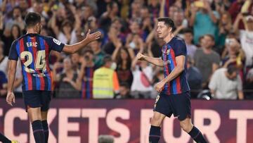 Barcelona's Polish forward Robert Lewandowski (R) greets Barcelona's Spanish forward Eric Garcia during the Spanish league football match between FC Barcelona and Athletic Club Bilbao at the Camp Nou stadium in Barcelona, on October 23, 2022. (Photo by Josep LAGO / AFP) (Photo by JOSEP LAGO/AFP via Getty Images)