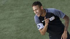 Brazilian Barcelona player Neymar gestures during a five-a-side football match, as part of a Neymar Junior Institute project, in Praia Grande, Sao Paulo, Brazil, July 9, 2016. / AFP PHOTO / Miguel SCHINCARIOL