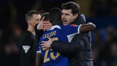 Chelsea's Argentinian head coach Mauricio Pochettino (R) embraces Chelsea's Ecuadorian midfielder #25 Moises Caicedo (L) on the pitch after the English FA Cup fifth round football match between Chelsea and Leeds United at Stamford Bridge, in London, on February 28, 2024. Chelsea won the game 3-2. (Photo by Glyn KIRK / AFP) / RESTRICTED TO EDITORIAL USE. No use with unauthorized audio, video, data, fixture lists, club/league logos or 'live' services. Online in-match use limited to 120 images. An additional 40 images may be used in extra time. No video emulation. Social media in-match use limited to 120 images. An additional 40 images may be used in extra time. No use in betting publications, games or single club/league/player publications. / 