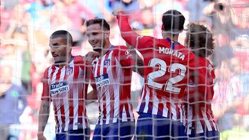 MADRID, SPAIN - APRIL 27: Saul Niguez of Atletico Madrid celebrates with team mates after their first goal which was an own goal by Joaquin Fernandez of Real Valladolid during the La Liga match between  Club Atletico de Madrid and Real Valladolid CF at Wa