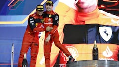 Formula One F1 - Bahrain Grand Prix - Bahrain International Circuit, Sakhir, Bahrain - March 20, 2022 Ferrari's Charles Leclerc celebrates on the podium after winning the race with second place Ferrari's Carlos Sainz Jr. REUTERS/Hamad I Mohammed