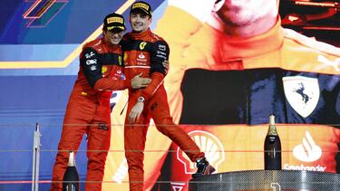Formula One F1 - Bahrain Grand Prix - Bahrain International Circuit, Sakhir, Bahrain - March 20, 2022 Ferrari's Charles Leclerc celebrates on the podium after winning the race with second place Ferrari's Carlos Sainz Jr. REUTERS/Hamad I Mohammed
