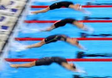 Kylie Masse of Canada, Anastasia Zueva of Russia and Kathleen Baker of the United States compete in the Women's 4 x 100m Medley Relay Final on Day 8 of the Rio 2016 Olympic Games at the Olympic Aquatics Stadium on August 13, 2016 in Rio de Janeiro, Brazil