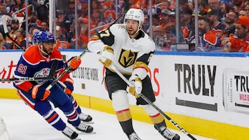 Vegas Golden Knights defensemen Shea Theodore (27) makes a pass in front of Edmonton Oilers forward Evander Kane (91)