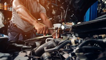 Auto mechanic are repair and maintenance auto engine is problems at car repair shop.