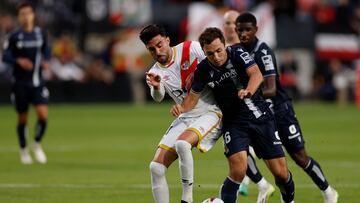 Rayo Vallecano's Spanish midfielder #14 Kike Perez fights for the ball with Real Sociedad's Spanish midfielder #16 Jon Ander Olasagasti during the Spanish league football match between Rayo Vallecano de Madrid and Real Sociedad at the Vallecas stadium in Madrid on October 29, 2023. (Photo by OSCAR DEL POZO / AFP)