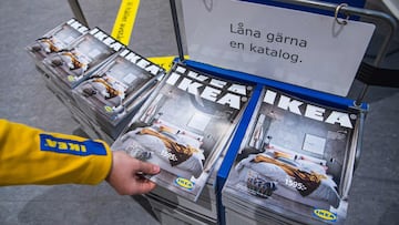 Catalogues are placed for people to take at the entrance to one of the stores of the Swedish furniture giant Ikea on December 7, 2020 in Jarfalla, near Stockholm. - Swedish furniture giant Ikea said Monday, December 7, 2020 it would stop printing its famed physical catalogue, printed yearly in tens of millions of copies, after 70 years, as customers move to digital alternatives. (Photo by Jonathan NACKSTRAND / AFP)