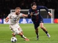 Bayern Munich's Austrian midfielder #27 Konrad Laimer fights for the ball with Paris Saint-Germain's Georgian forward #07 Khvicha Kvaratskhelia during the UEFA Champions League, league phase day 4, football match between Paris Saint-Germain (PSG) and FC Bayern Munich at the Parc des Princes in Paris, on November 4, 2025. (Photo by FRANCK FIFE / AFP)