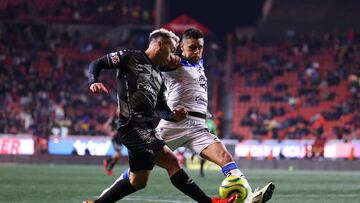 Lucas Rodriguez (L) of Tijuana fights for the ball with Kevin Escamilla (R) of Queretaro during the 6th round match between Tijuana and Queretaro as part of the Torneo Clausura 2024 Liga BBVA MX at Caliente Stadium on February 09, 2024 in Tijuana, Baja California, Mexico.
