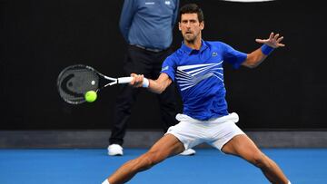 Serbia's Novak Djokovic hits a return against Mitchell Krueger of the US during their men's singles match on day two of the Australian Open tennis tournament in Melbourne on January 15, 2019. (Photo by Paul Crock / AFP) / -- IMAGE RESTRICTED TO EDITORIAL USE - STRICTLY NO COMMERCIAL USE --