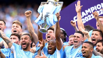 FILE PHOTO: Soccer Football - Premier League - Manchester City v Aston Villa - Etihad Stadium, Manchester, Britain - May 22, 2022 Manchester City's Fernandinho lifts the trophy as he celebrates with teammates after winning the Premier League REUTERS/Hannah Mckay EDITORIAL USE ONLY. No use with unauthorized audio, video, data, fixture lists, club/league logos or 'live' services. Online in-match use limited to 75 images, no video emulation. No use in betting, games or single club /league/player publications.  Please contact your account representative for further details.     TPX IMAGES OF THE DAY/File Photo