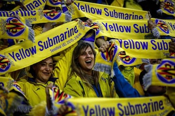 Villarreal supporters hold their team's scarves during the UEFA Europa League semifinal first leg football match Villarreal CF vs Liverpool FC at El Madrigal stadium in Vila-real on April 28, 2016.