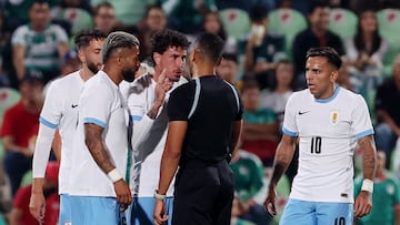 Soccer Football - International Friendly - Mexico v Uruguay - Estadio Corona, Torreon, Mexico - November 15, 2025 Uruguay's Jose Maria Gimenez remonstrates with referee Fernando Moron REUTERS/Henry Romero