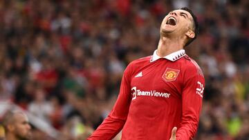 Manchester United's Portuguese striker Cristiano Ronaldo reacts after failing to reach a pass during the English Premier League football match between Manchester United and Arsenal at Old Trafford in Manchester, north west England, on September 4, 2022. (Photo by Oli SCARFF / AFP) / RESTRICTED TO EDITORIAL USE. No use with unauthorized audio, video, data, fixture lists, club/league logos or 'live' services. Online in-match use limited to 120 images. An additional 40 images may be used in extra time. No video emulation. Social media in-match use limited to 120 images. An additional 40 images may be used in extra time. No use in betting publications, games or single club/league/player publications. / 
