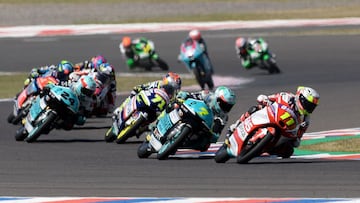 Gaviota GASGAS Aspar Team Spanish rider Sergio Garcia (R) overtakes Honda Leopard Racing Italian rider Dennis Foggia in the last lap of the Argentina Grand Prix Moto3 race at the Termas de Rio Hondo circuit, in Termas de Rio Hondo, in the Argentine northe