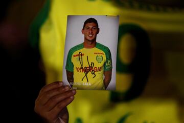 A fan holds a portrait of Emiliano Sala in Nantes' city center after news that newly-signed Cardiff City soccer player Emiliano Sala was missing after the light aircraft he was travelling in disappeared between France and England the previous evening, acc