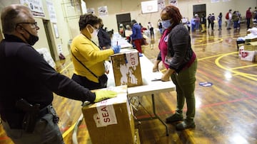 LUMBERTON, NC - NOVEMBER 03: Volunteers hand in ballot boxes across the street from the Robeson County Board of Elections on November 3, 2020 in Lumberton, North Carolina. After a record-breaking early voting turnout, Americans head to the polls on the la