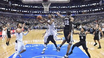 Nov 14, 2017; Dallas, TX, USA; Dallas Mavericks guard Dennis Smith Jr. (1) drives to the basket past San Antonio Spurs forward LaMarcus Aldridge (12) and guard Dejounte Murray (5) during the second half at the American Airlines Center. The Spurs defeat the Mavericks 97-91. Mandatory Credit: Jerome Miron-USA TODAY Sports