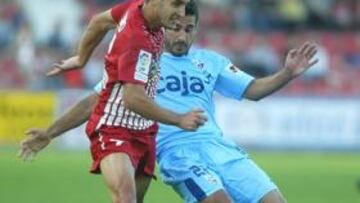 El Girona falla en estrategia y el Huesca saca petróleo